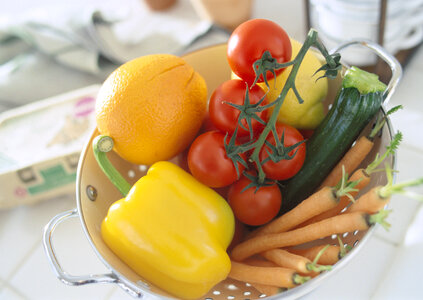Closeup on table with vegetables in kitchen photo
