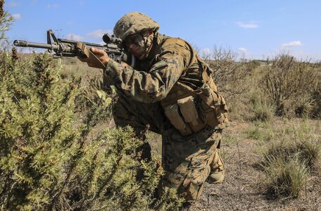 US marine aiming a gun photo