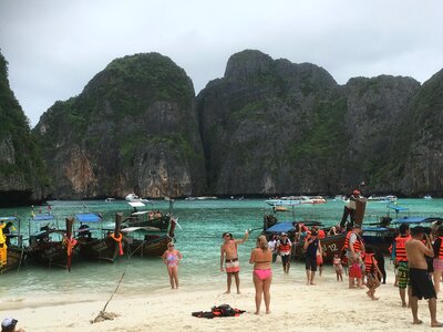 Tourists on white sand beach at Tachai island,Thailand photo