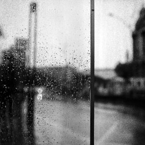 Rain drops on window , rainy day photo