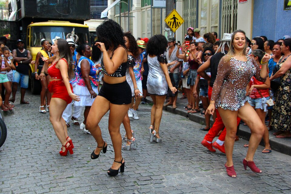 A group of girls in beautiful costumes are dancing at Festival