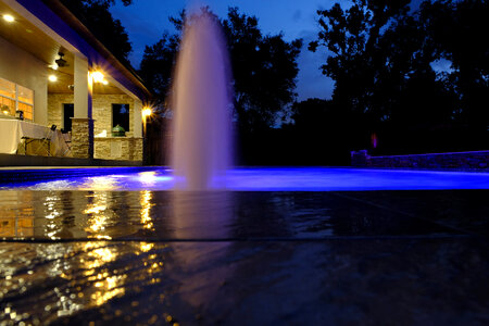 Pool and garden by night photo
