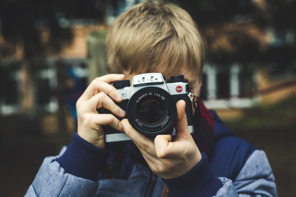 Young cheerful photographer