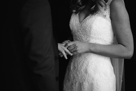 Bride and groom hands with wedding rings photo