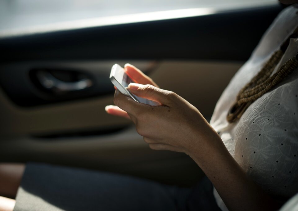 Beautiful young woman using smart phone