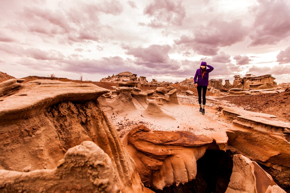 young woman hiker hiking in beautiful mountains