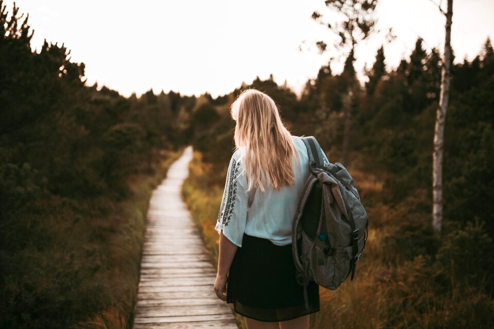 young woman hiker hiking in beautiful mountains
