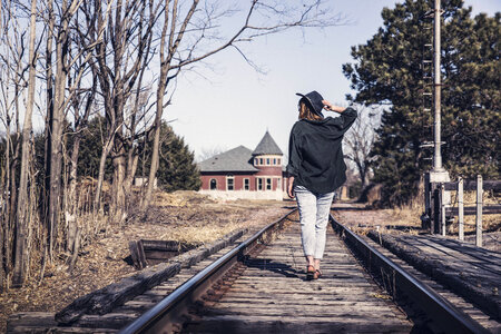 Woman walking on railway