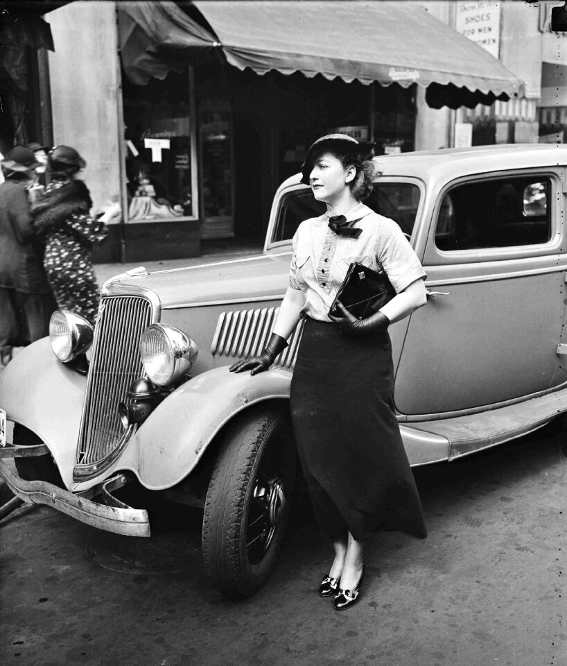 Sexy girl is shown with long black dress from 1935