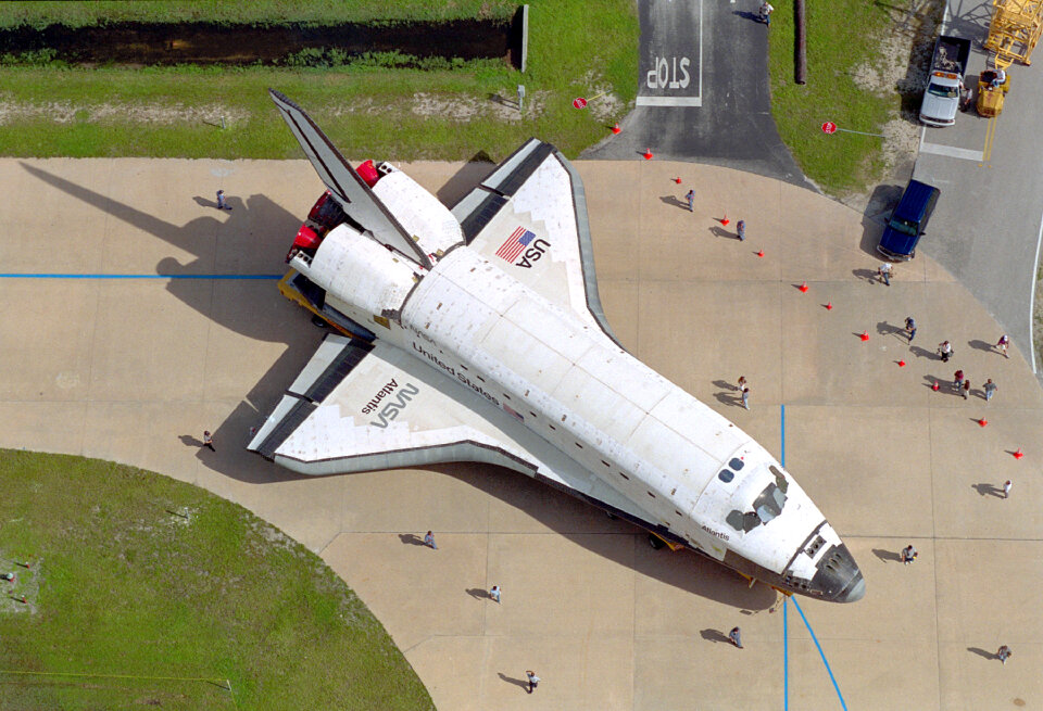 Carried atop an orbiter transporter,