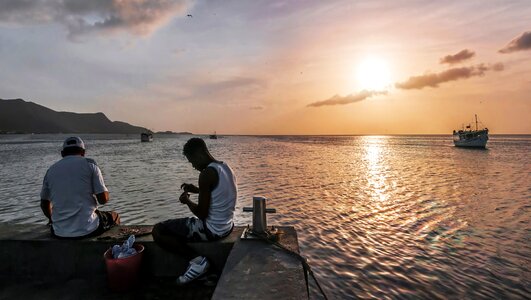 Fishermen with his son on Pier Juan Griego