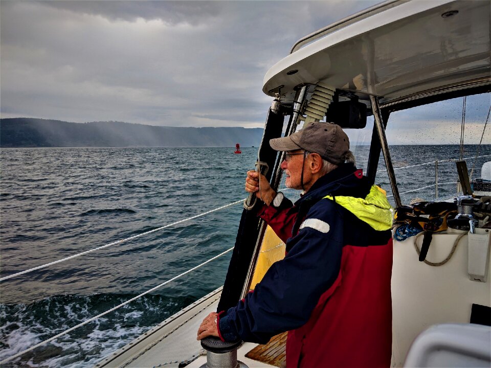 Portrait of a senior fisherman on deck of a boat
