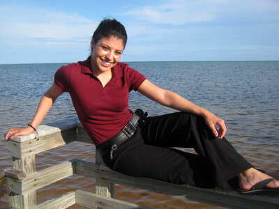 Young Latin woman in front of the sea