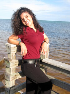 Young Latin woman in front of the sea photo