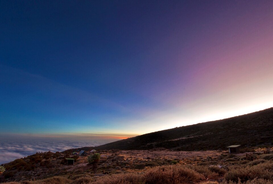 Mount Kilimanjaro and clouds line at sunset