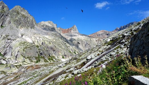 Mountain hiking trail around azure waters of Gelmersee