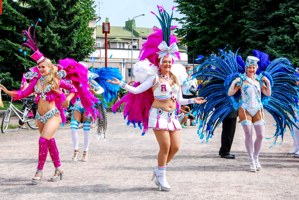 Unknown woman dancing samba on the street