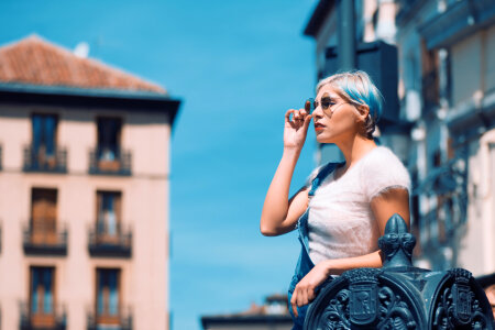 Beautiful young woman walking on the street photo