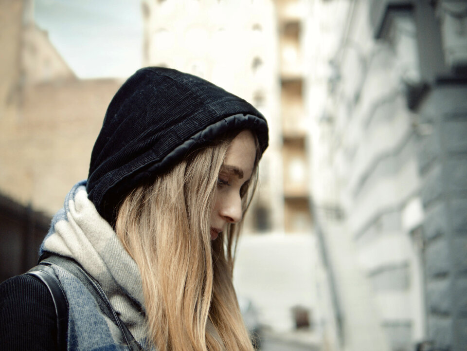 portrait of a beautiful sad girl in a hat
