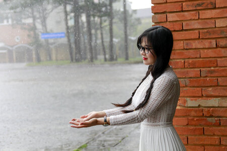 Japanese Woman standing under the rain