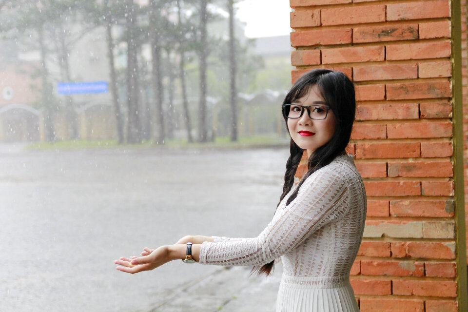 Japanese Woman standing under the rain