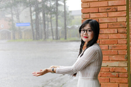 Japanese Woman standing under the rain