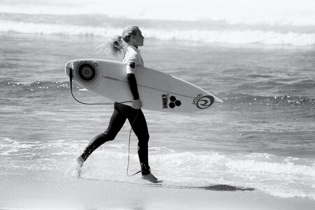 Attractive female surfer with surfboard