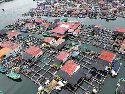 A fishing village of fishermans on the sea water in island Hainan photo