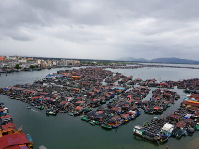 A fishing village of fishermans on the sea water in island Hainan photo
