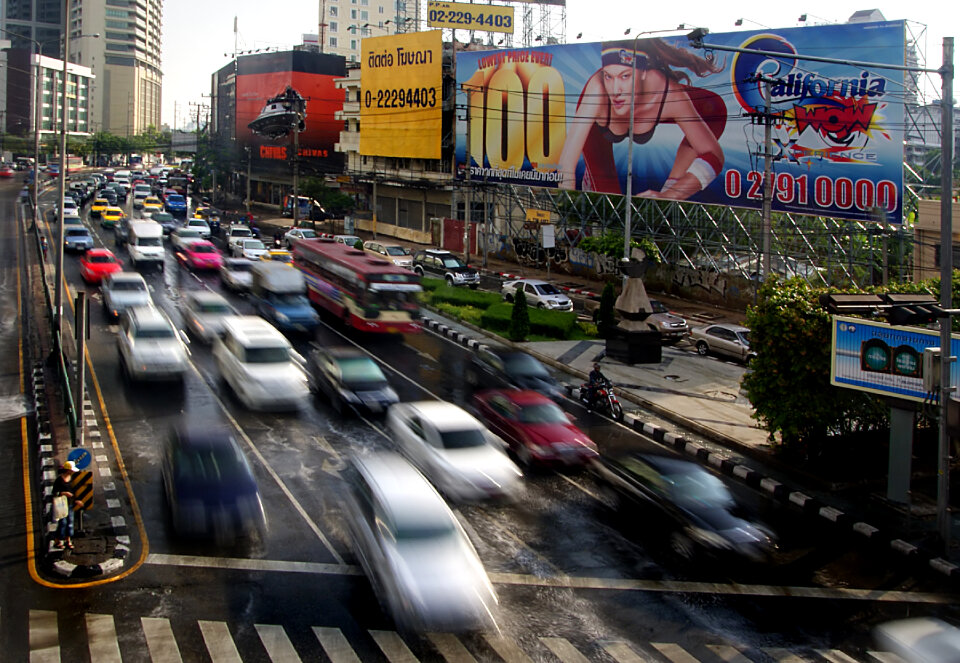 Traffic moves slowly along a busy road in Bangkok, Thailand