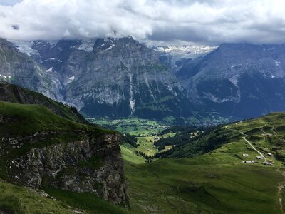 Idyllic landscape in the Alps with fresh green meadows photo