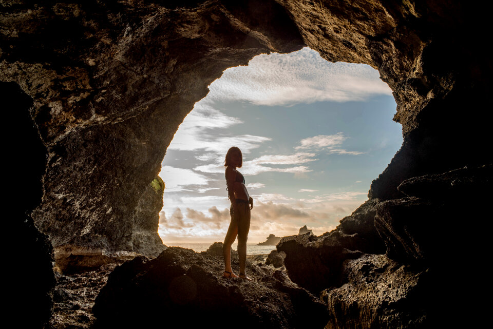 woman in a cave in the sea