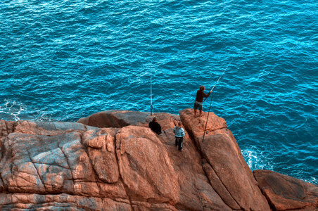 Fishing from the rocks on the seashore