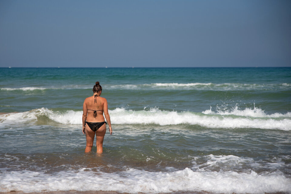 Woman in Beautiful landscape of Taormina, Italy