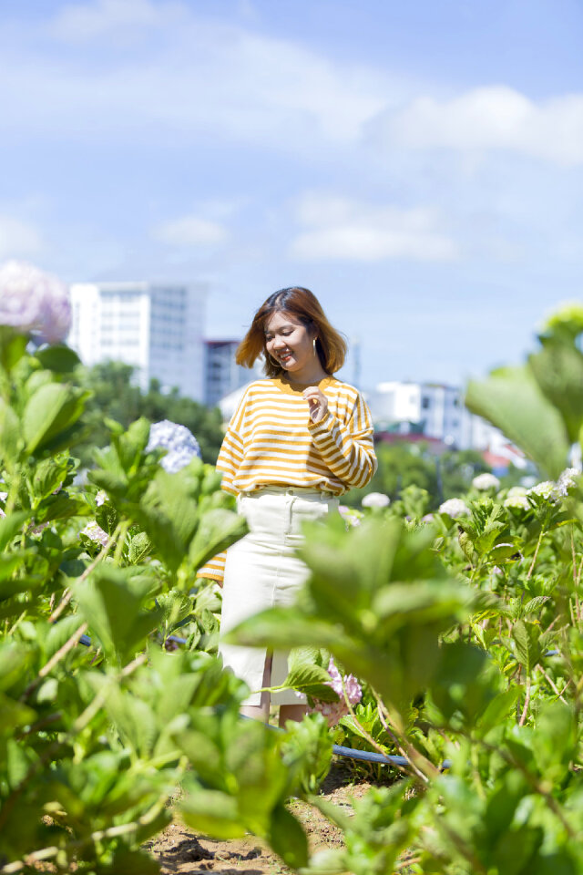 Beautiful Asian Girl smell of the flower