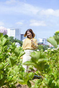 Beautiful Asian Girl smell of the flower photo