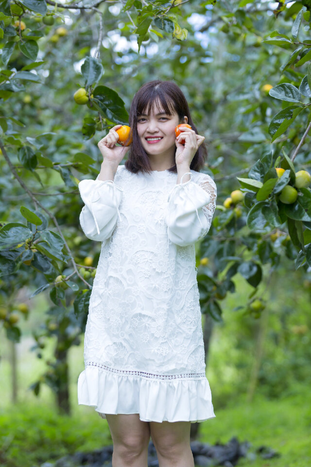 Pretty Asian Girl In wild flowers garden