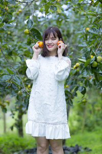 Pretty Asian Girl In wild flowers garden photo