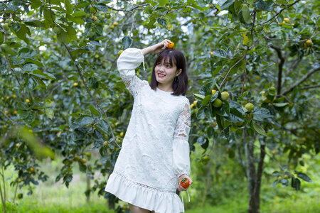 Pretty Asian Girl In wild flowers garden
