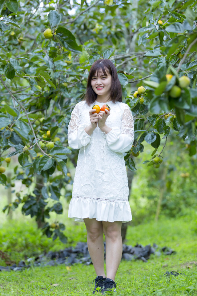 Pretty Asian Girl In wild flowers garden
