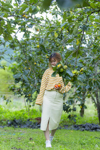 Pretty Asian Girl In wild flowers garden