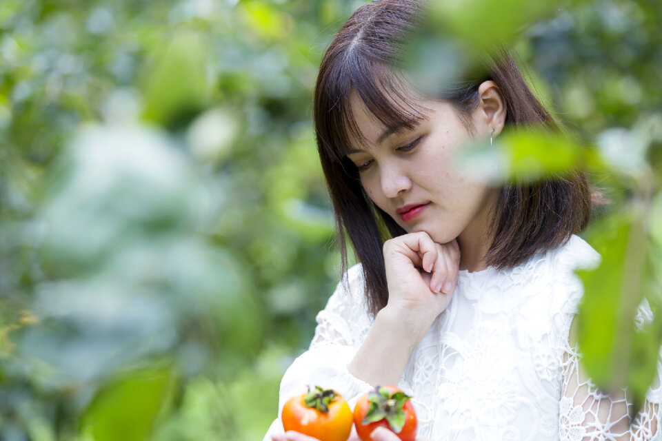 Pretty Asian Girl In wild flowers garden