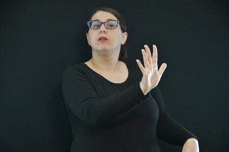 Woman learns sign language photo