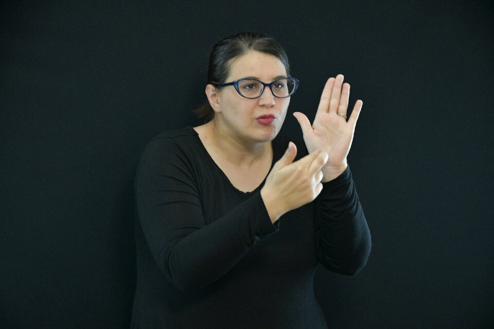Woman learns sign language