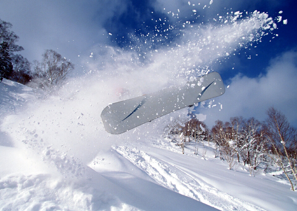 skier in deep powder on a steep slope