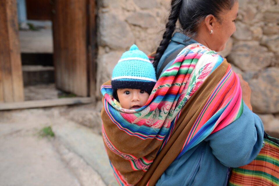 An unidentified Indian woman carries baby