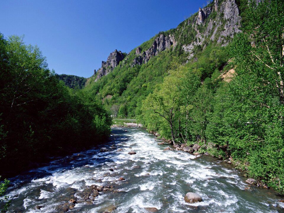 Mountain, river with blue sky and clouds