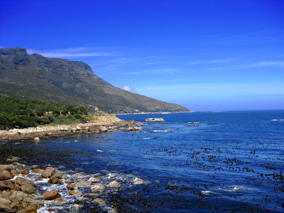 Rocky coastline leading down to Cape Point in South Africa photo