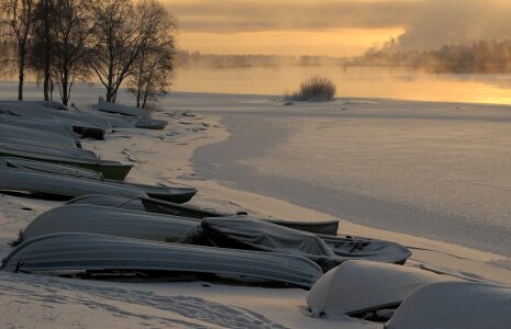 winter landscape misty morning on the river at sunrise photo