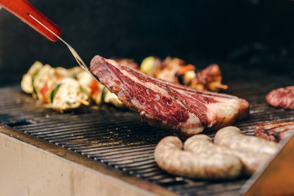Flipping A Big Ribeye Steak On Bbq